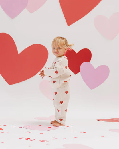 Cream knit pants with red hearts